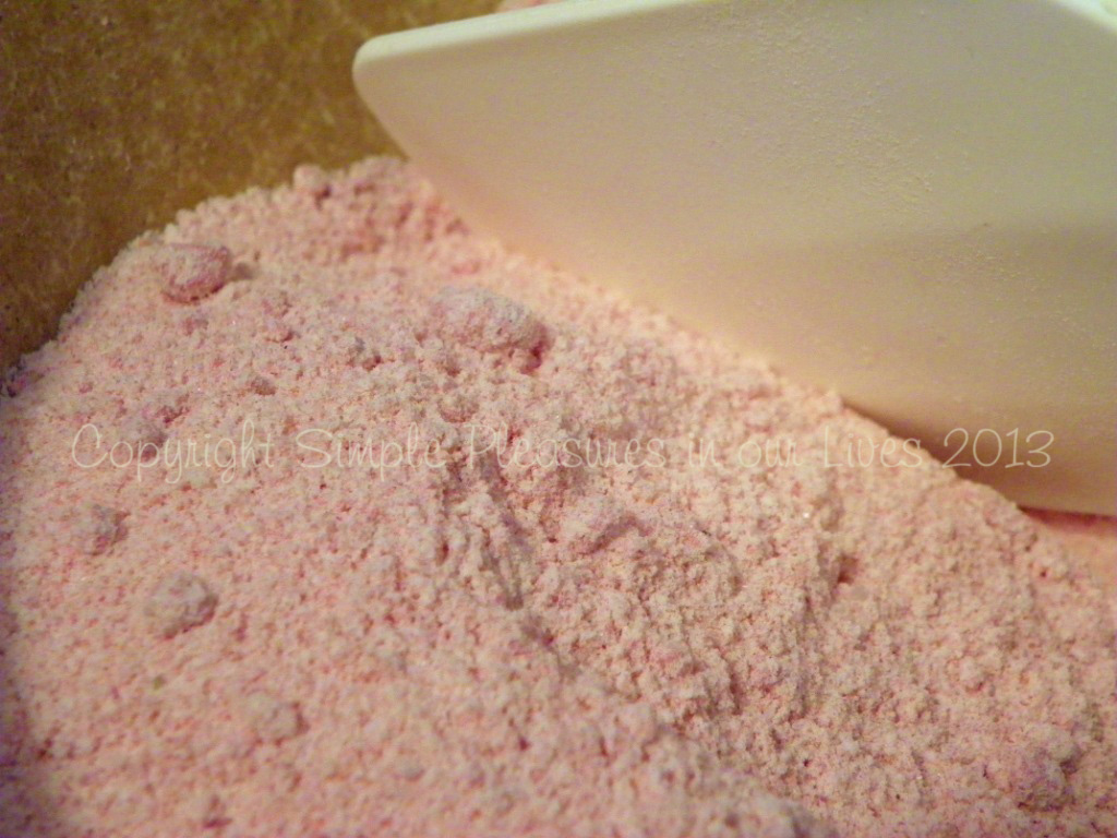 breaking up clumps of ground strawberries with a rubber scraper if necessary.