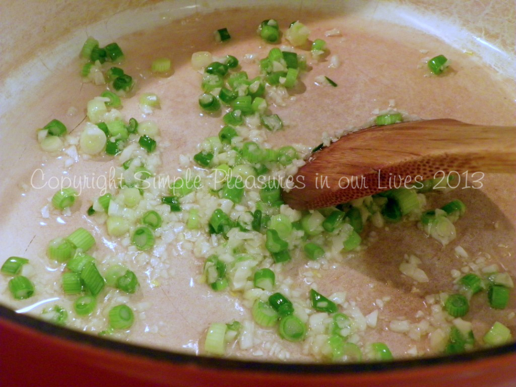 Cook garlic and white part of green onions until fragrant