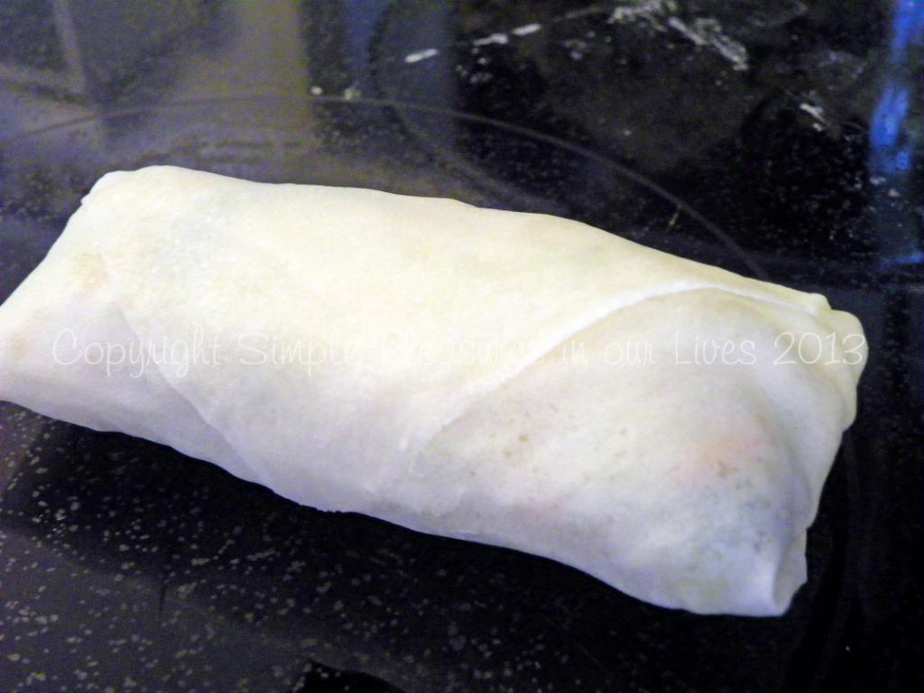 Continue to roll the spring roll until the end